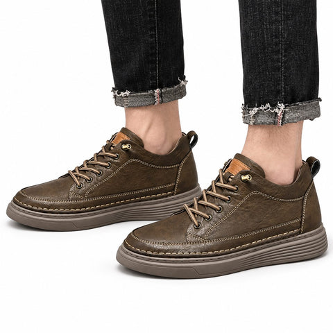 Altura brown casual lace up shoes with stitched panels and cushioned soles worn with cuffed black jeans for a modern elevated style