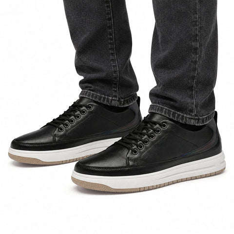 Brooklyn black casual sneakers with white platform soles and a discreet height boost shown worn with jeans for a modern elevated look