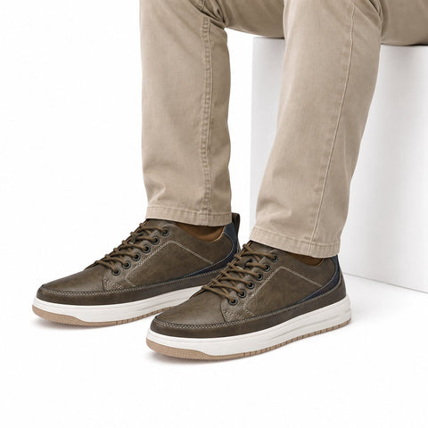 Brooklyn elevated casual shoes in brown leather with contrast stitching and white soles shown on a model for a modern look with a discreet height boost