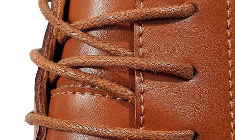 Close-up of a tan Charleston shoe with a hidden internal lift for a discreet height boost.