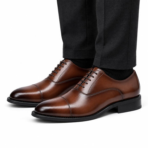 Monarch light brown leather men's dress shoes with cap toes and polished finish styled with black trousers for a discreet height boost