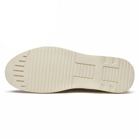 Sole view of the Navigator shoe, showing a light-colored outsole with a textured grip pattern.