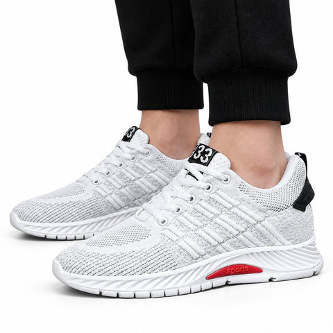 Rise33 white mesh sneakers with cushioned soles and discreet height boost shown on feet for modern athletic style and everyday comfort