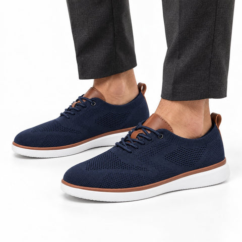 Strider blue men's casual shoes with breathable knit uppers, white midsoles and brown trim shown on a model for a discreet height boost