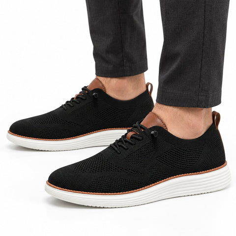 Strider black casual sneakers with breathable knit uppers and thick white soles offering a discreet height boost