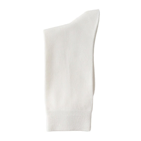 The Essential Dress Sock in white, shown flat with a ribbed cuff.