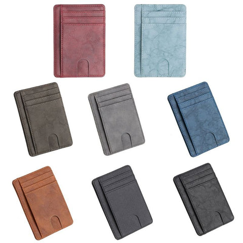 Seven slim cardholders in red, light blue, brown, black, and shades of gray, shown side by side.