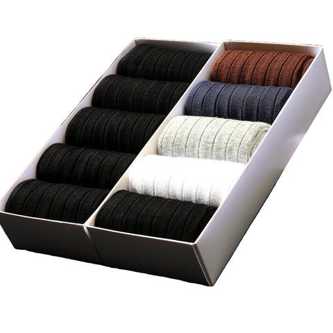 A gift box containing pairs of The Presidential Dress Sock in black, gray, white, navy, and brown.