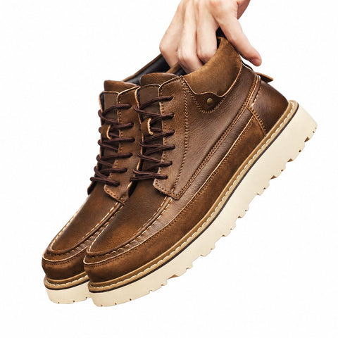 Timberline brown leather mens casual boots with lace up ankle design and contrasting cream lug soles shown as a pair