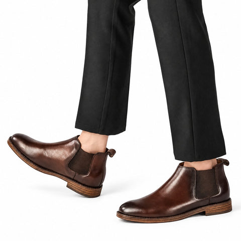 Wellington brown leather Chelsea boots with elastic side panels and a discreet height boost styled with black trousers