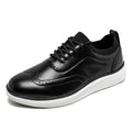 Prescott men's black leather height increasing shoes with brogue detailing, white sole, and comfortable insoles offering a discreet lift for enhanced confidence and style.