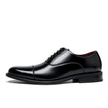 Black dress shoe on a white background