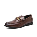 Brown Whitmore men's dress shoe with discreet height boost, smooth leather upper, decorative metal accent, and comfortable insoles for an elevated, stylish appearance.