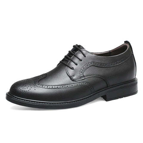 Black leather dress shoe on a white background