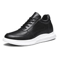 Black leather sneaker with white sole on a white background, featuring an invisible height increase of 2.4 inches.