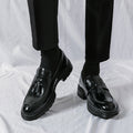 Sterling black polished leather men's dress shoes with tassels, offering a discreet height boost and hidden lift for enhanced confidence and modern style.