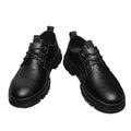 Pair of black leather shoes on a white background