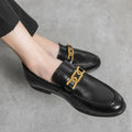 Black leather Whitmore men's dress shoes with a discreet height boost and gold chain detail, designed for comfort and modern style with hidden lift technology.