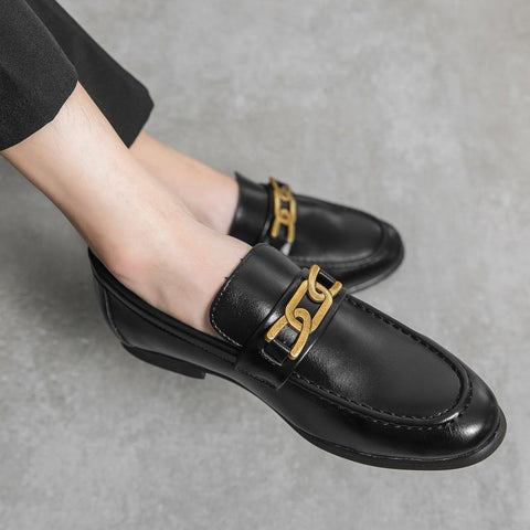 Black leather Whitmore men's dress shoes with a discreet height boost and gold chain detail, designed for comfort and modern style with hidden lift technology.
