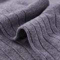 Close-up of textured gray fabric with folds