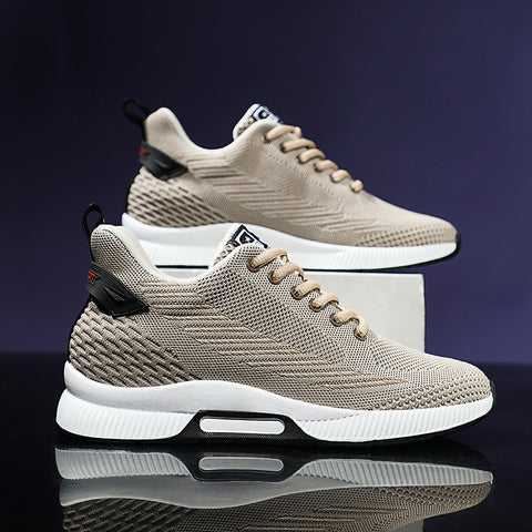 Beige sneaker with black accents on a gray background