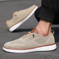 A pair of beige Strider modern height increasing shoes featuring breathable knit fabric, brown accents, and white soles designed for discreet elevation and comfortable wear.