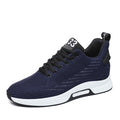 Navy blue athletic shoe with white sole on a white background