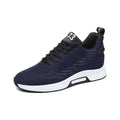 Ascend33 blue men's performance sneaker with textured knit upper, cushioned white sole and a discreet height boost for everyday comfort