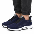Ascend33 blue men's sneakers with black laces and white soles, featuring a modern design and a discreet height boost for everyday wear