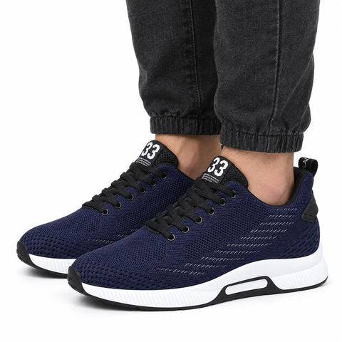 Ascend33 blue men's sneakers with black laces and white soles, featuring a modern design and a discreet height boost for everyday wear