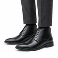 Ashford black leather elevator dress boots with pointed toes and a discreet height boost for polished formal style