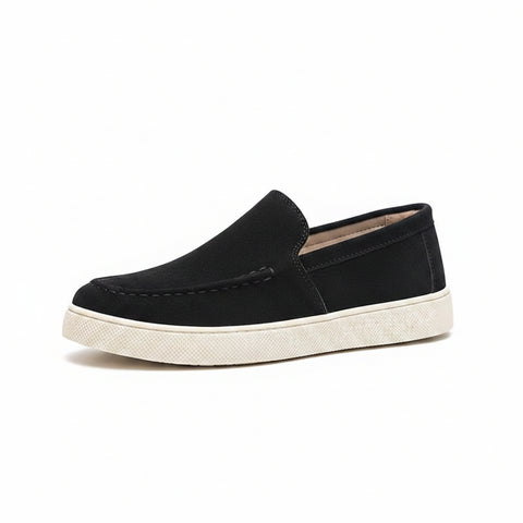 Black slip-on casual shoe with white sole featuring a discreet height boost, designed for comfort and style in the Ellison collection by Modern Elevation.