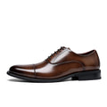 Brown leather dress shoe on a white background