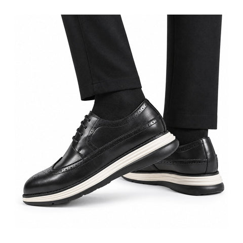 Hartford black leather elevator dress shoes with white layered soles shown on a model featuring a polished lace up design and discreet height boost