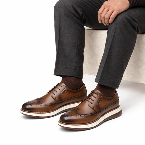 Hartford light brown leather lace up dress shoes with brogue detailing and a discreet height boost styled with tailored trousers