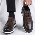 Brown Hartford men's dress shoes with brogue detailing and white soles, featuring a discreet hidden lift for everyday comfort and a subtle height boost.