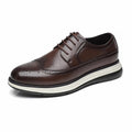 Hartford men's brown wingtip dress shoe with brogue detailing, featuring a discreet height boost and hidden internal lift for everyday comfort.