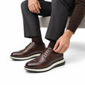 Hartford dark brown leather men's dress shoes with lace up styling and a discreet height boost shown with dark trousers