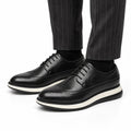 Hartford black men's dress shoes with brogue detailing and a layered sole offering a discreet height boost for polished professional style