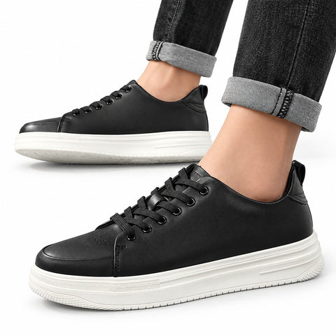 Hawthorn black casual shoes with thick white soles, shown worn with cuffed jeans, featuring a discreet height boost and modern sneaker styling