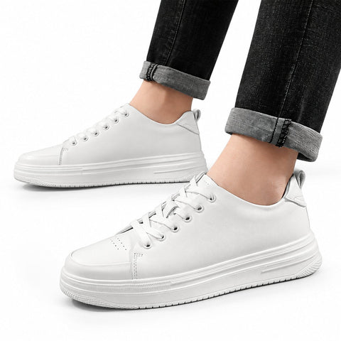 Hawthorn white casual elevator shoes with clean lace up styling and thick soles shown with cuffed black jeans for a discreet height boost and modern everyday look