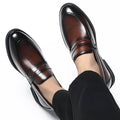 Kensington men's dress shoes in polished brown with black accents, featuring a hidden lift for a discreet height boost.