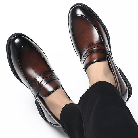 Kensington men's dress shoes in polished brown with black accents, featuring a hidden lift for a discreet height boost.