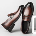 Kensington men's dress shoes in polished brown with black accents, featuring a discreet height boost and hidden internal lift for everyday comfort and refined style.