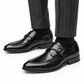 Lennox black men's dress shoes with polished leather finish and buckle straps styled with pinstripe trousers for a refined elevated look and discreet height boost
