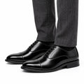 Monarch black men's dress shoes with polished cap toes lace up design and discreet height boost for a refined professional look