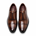 Monarch polished light brown men's dress shoes with cap toes, open lacing and sleek black soles offering a discreet height boost