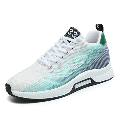 White and teal Peak33 sneaker with a mesh upper and black accents, featuring a hidden lift for a discreet height boost.