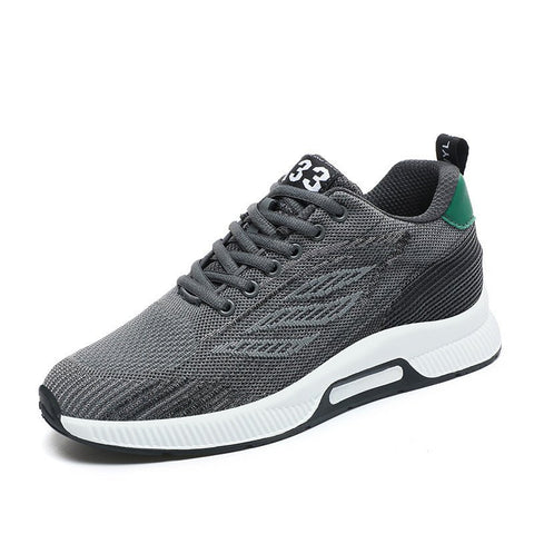 Gray Peak33 sneaker with a modern knit upper, black and green accents, white sole, and discreet height-increasing hidden lift for everyday comfort and style.