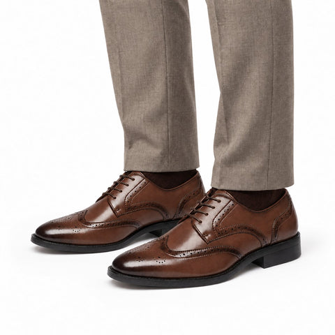 Prestige brown leather mens dress shoes with brogue detailing and lace up styling shown with tailored trousers for a polished look and discreet height boost